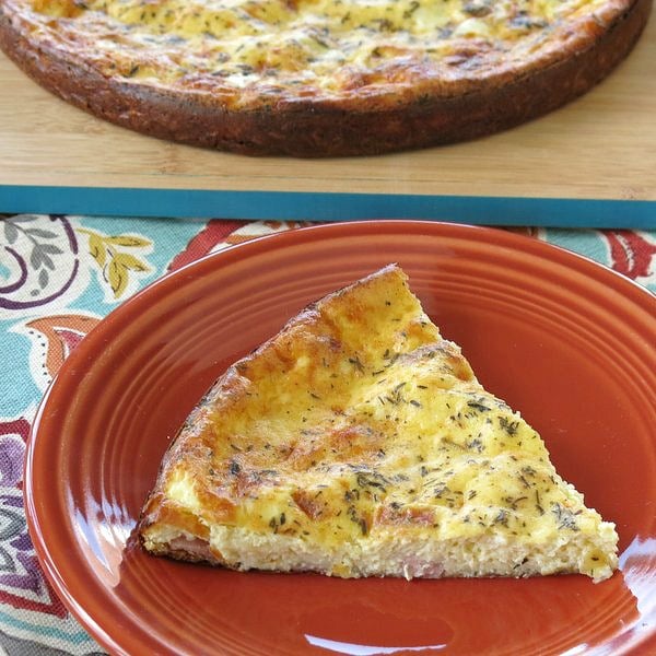 Slice of crustless quiche on plate