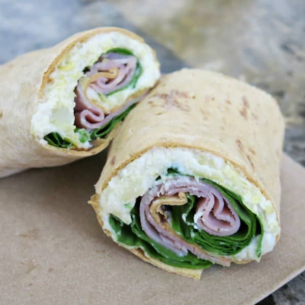 Sandwich wrap with warm artichoke dip, ham and spinach