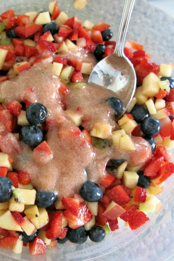 Fruit salsa in bowl with jam and stevia glaze drizzled on top.