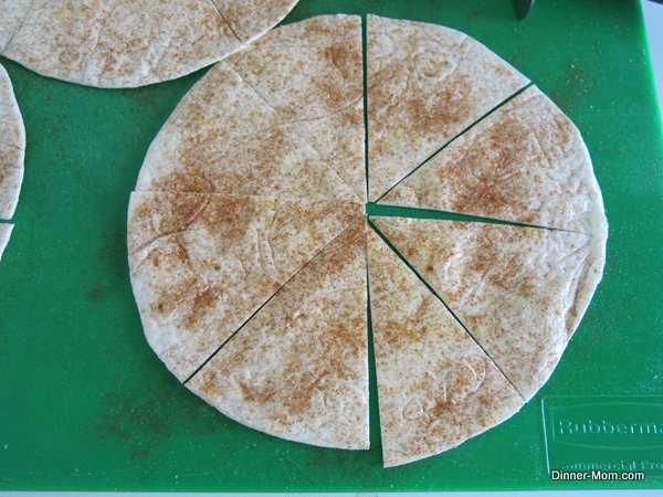 Flour tortilla sprinkled with cinnamon and stevia sugar blend on cutting board