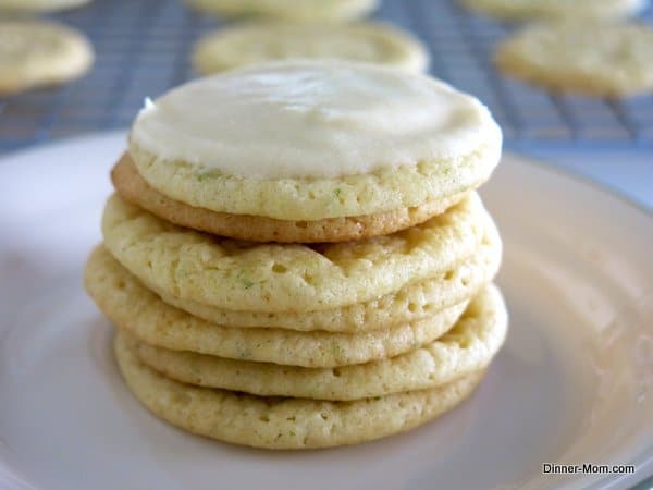 Key Lime Cookies with Key Lime Icing stacked on a plate.