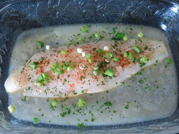 Basa fish with lemon, parsley and green onion topping