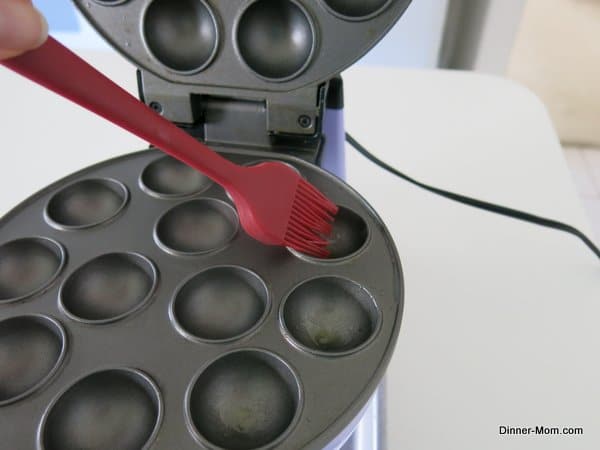 Brushing Wells of Cake Pop Maker with Olive Oil