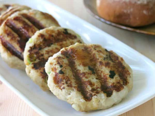 Grilled Turkey Burgers with Mango Chutney on a rectangle plate.