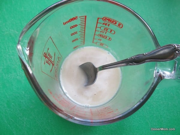 Dissolved yeast mixture for pretzel bites in bowl.
