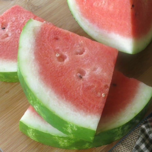 Watermelon slices on cutting board