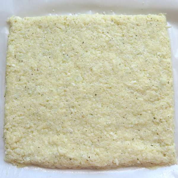 Cauliflower pizza dough rolled flat into rectangle shape