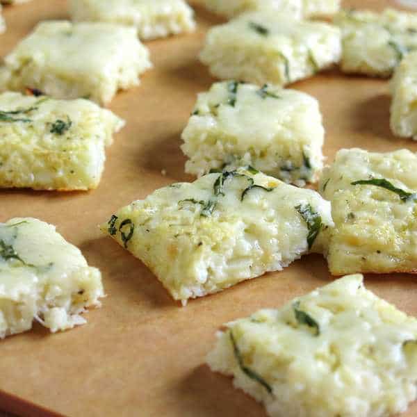 Small rectangle Cauliflower Pizza Bites on a cutting board