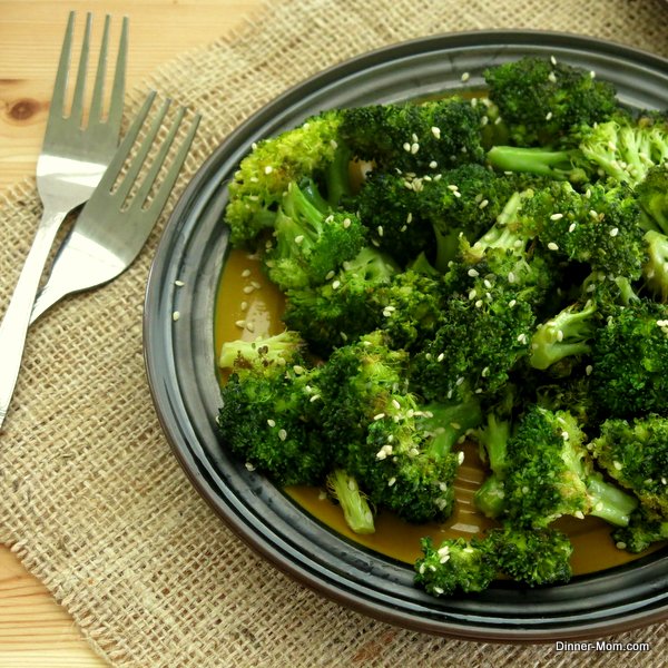 Roasted Broccoli with Sesame Drizzle on plate with 2 forks next to it