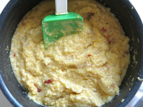 Pot of cooked southern grits with sundried tomatoes