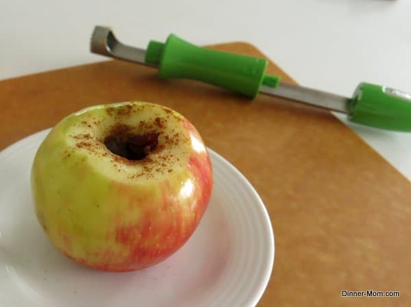 Apple with core removed with cinnamon sprinkled on top