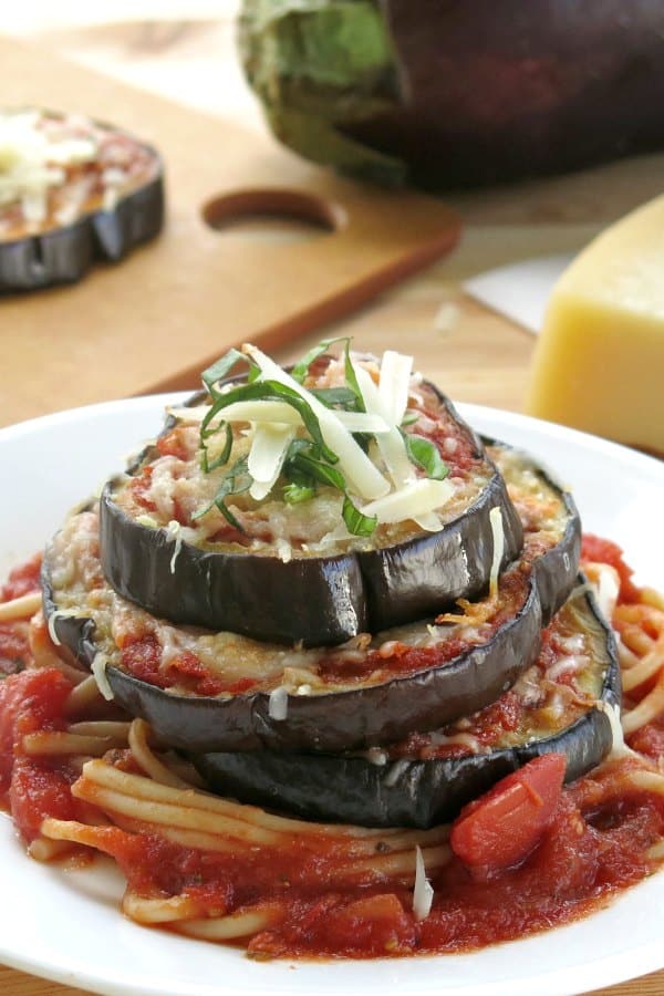 Eggplant Stacks on plate covered with noodles