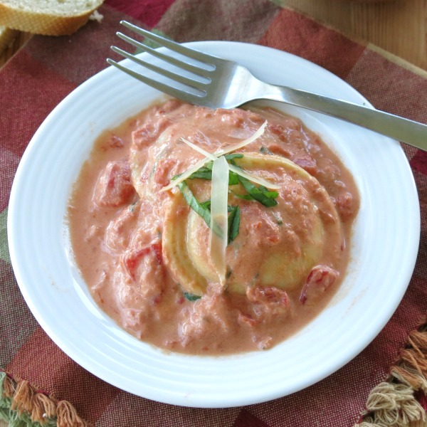 Easy Tomato Cream Sauce over Ravioli in a bowl with a fork