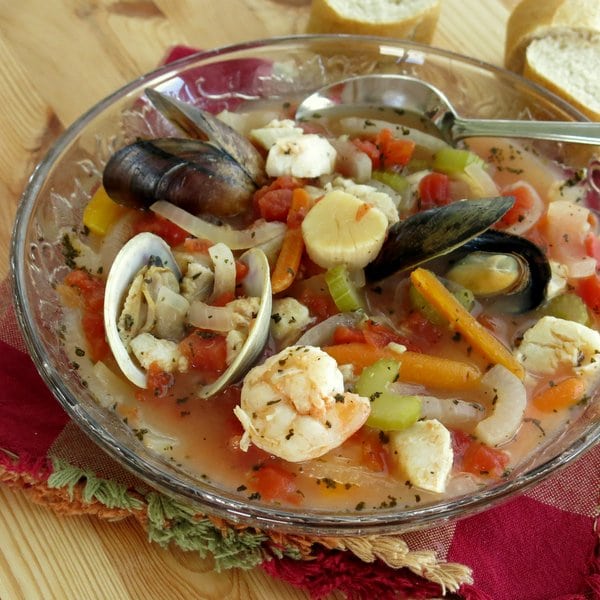 Italian Seafood Soup in bowl with spoon