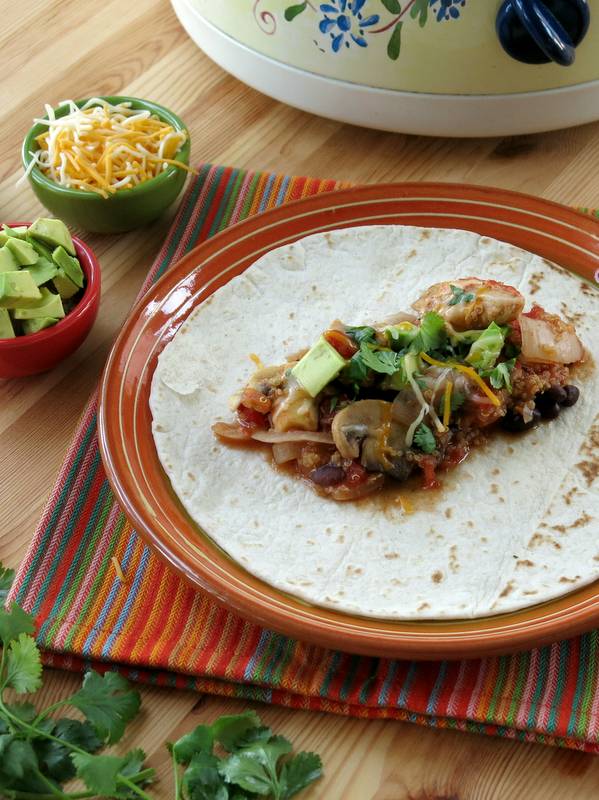 Slow Cooker Chicken Fajitas mixture on open tortilla