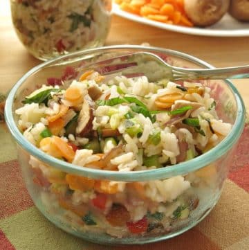 Vegetable Rice Pilaf Recipe in glass bowl with fork