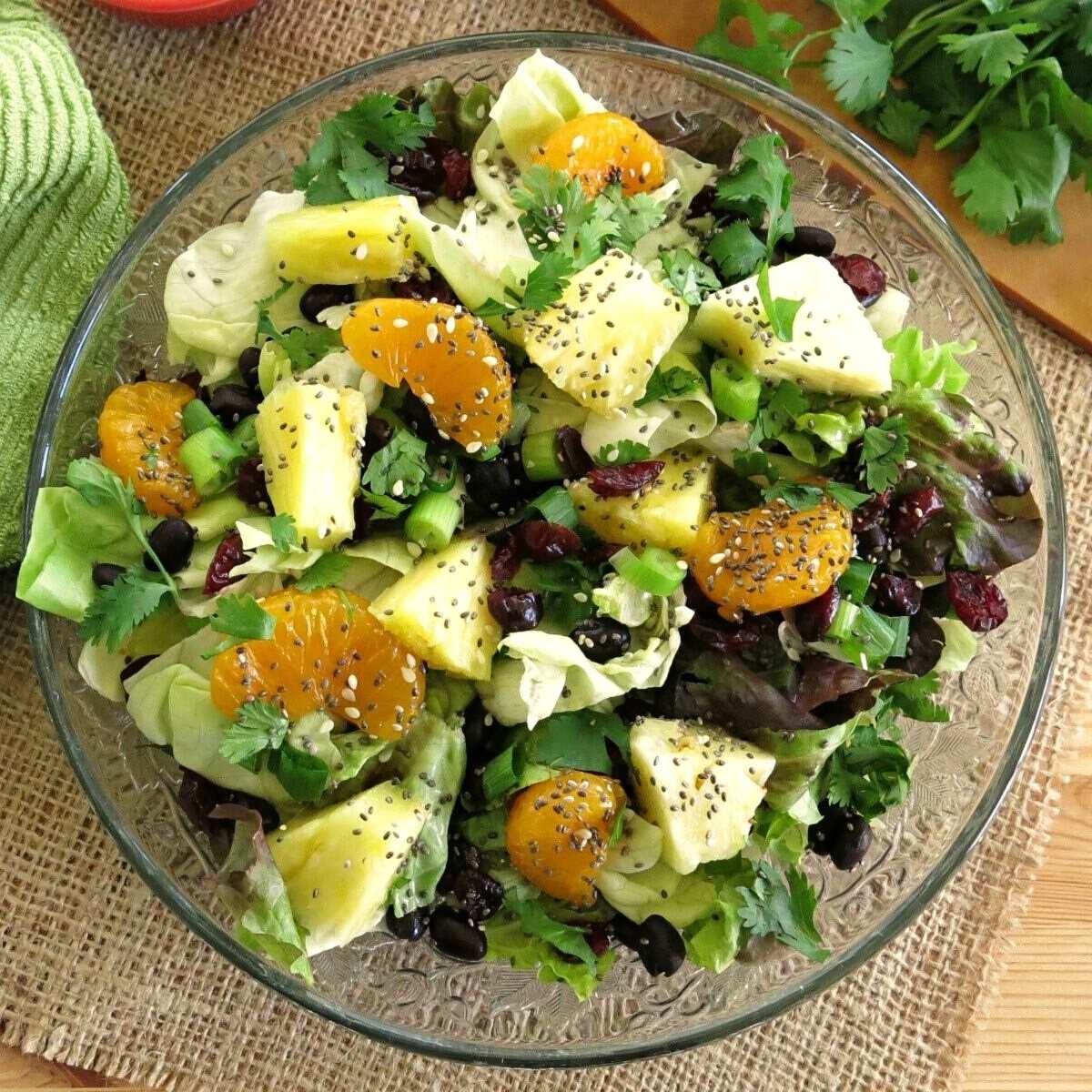 Caribbean salad with honey lime dressing on a salad plate.