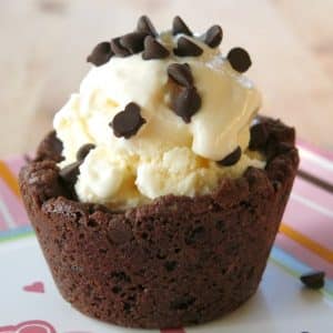 Chocolate Chip Cookie Cup with ice cream inside and topped with chocolate chips