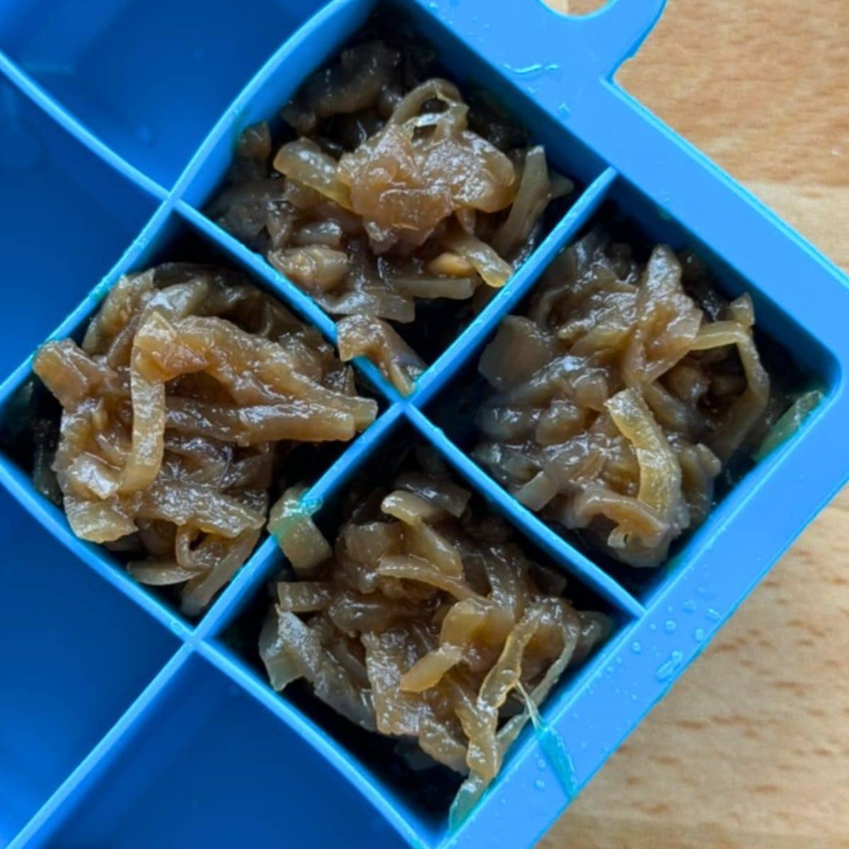 Caramelized onions in an ice cube tray ready for the freezer.