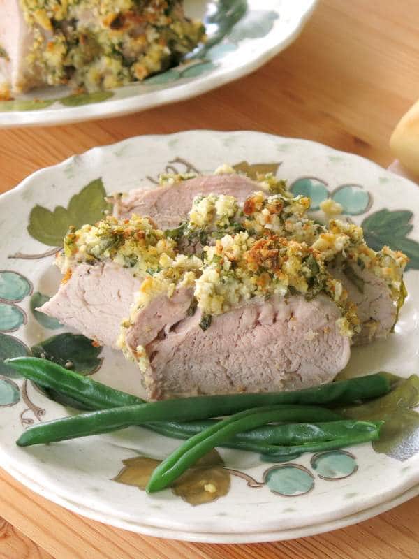 Herb Crusted Pork Tenderloin sliced on plate