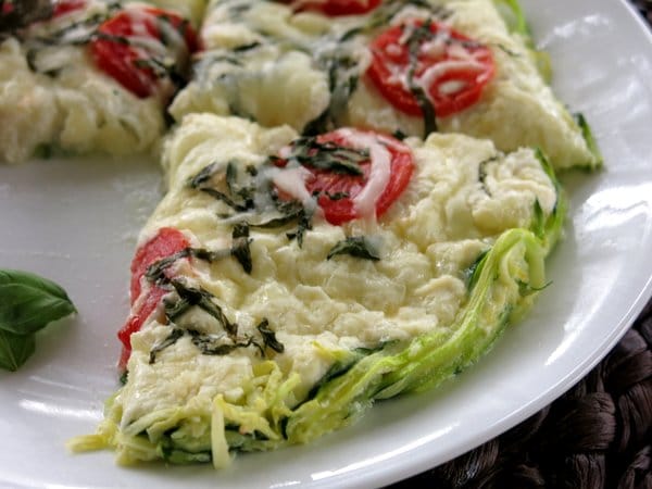 Outer edge of zucchini pizza pie cut into slices