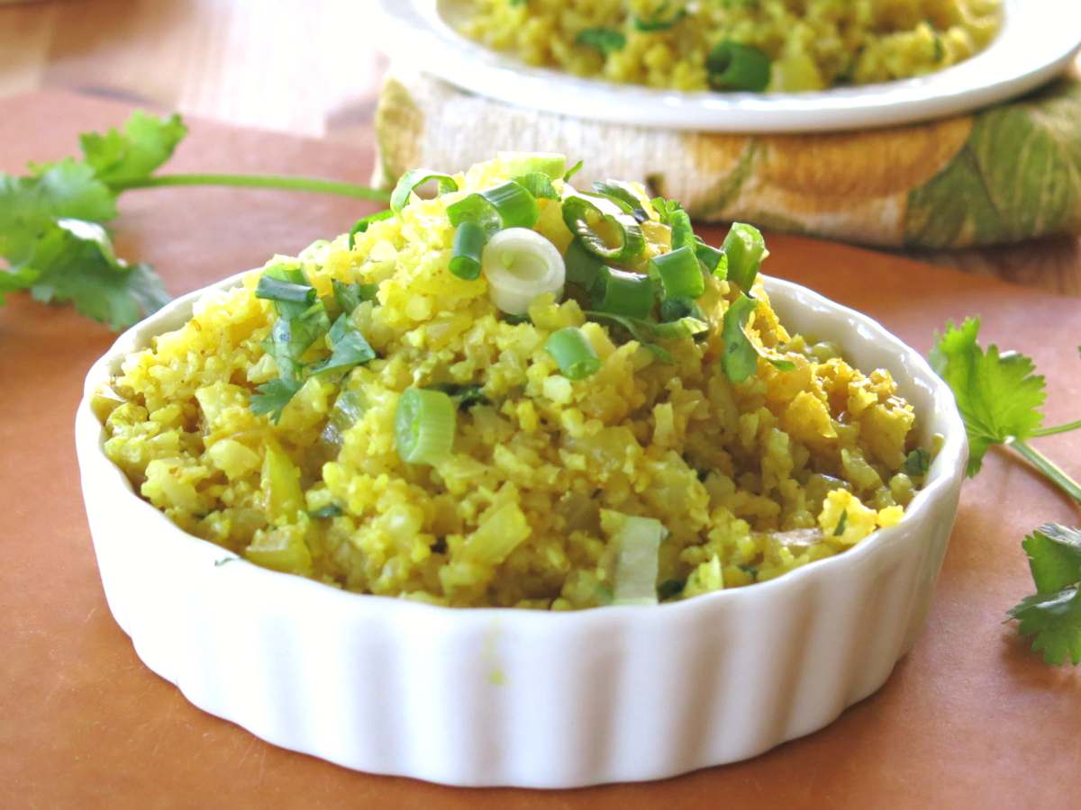 Cooked curry cauliflower rice recipe in a large bowl.