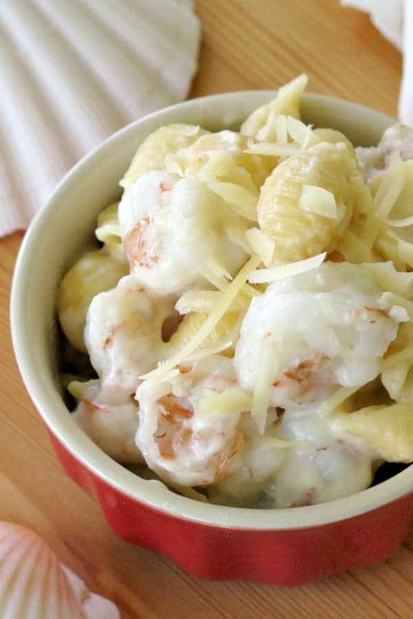 Shrimp Mac and Cheese in a small bowl with shells around it