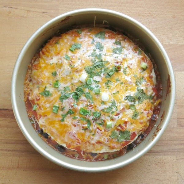 cooked stacked burrito pie casserole in a round pan