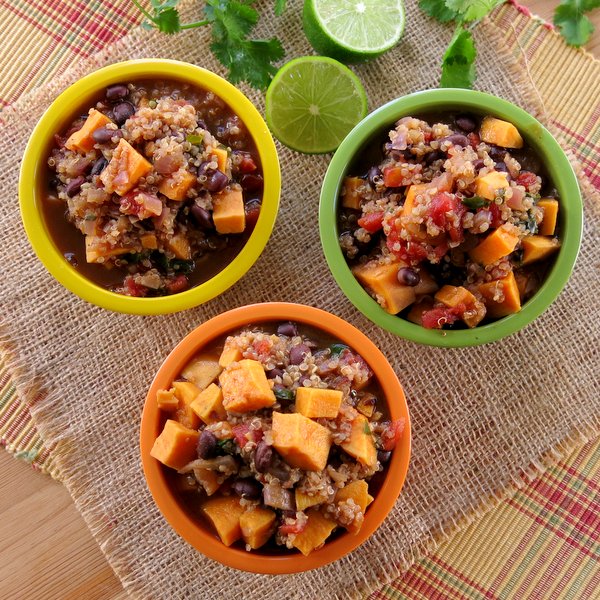 Three bowls of Sweet Potato Black Bean Chili with Quinoa with limes next to it.