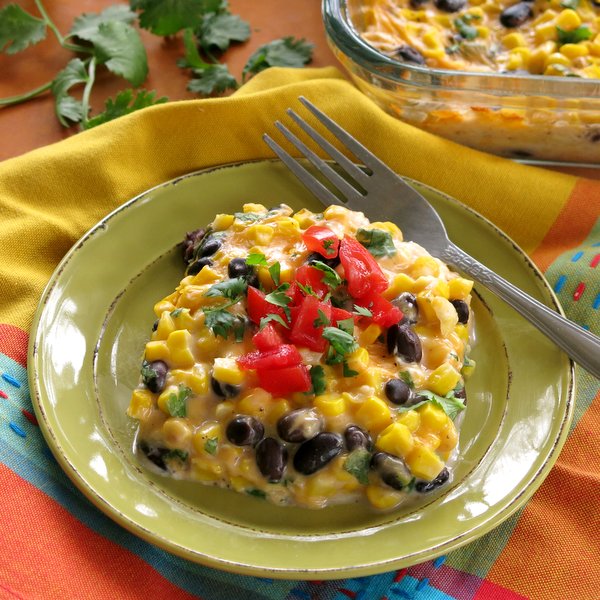 Tex Mex Cheddar Corn Casserole Recipe on plate with a fork next to it