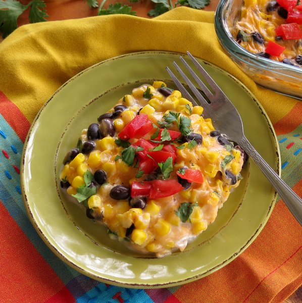 Overhead shot of Mexican Cheddar Corn Casserole Recipe with fork on plate 