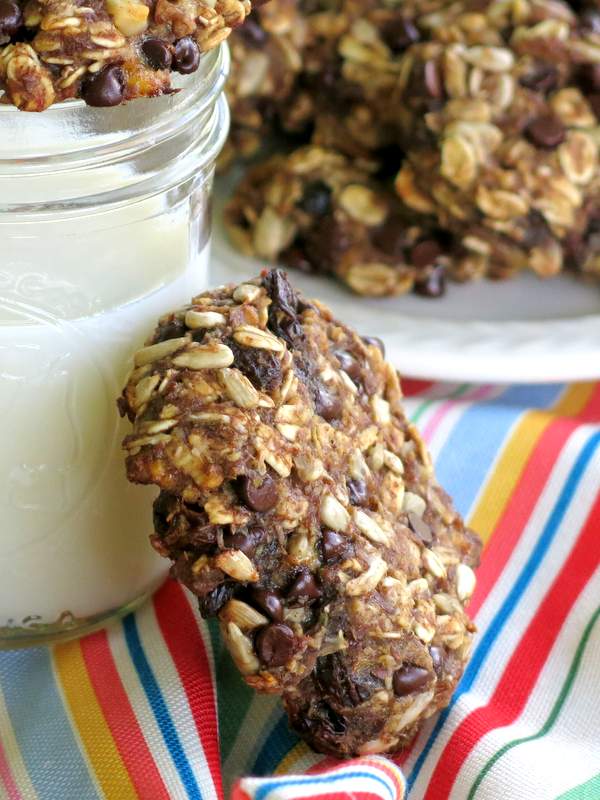 Healthy Everything Cookie leaning on cup of milk