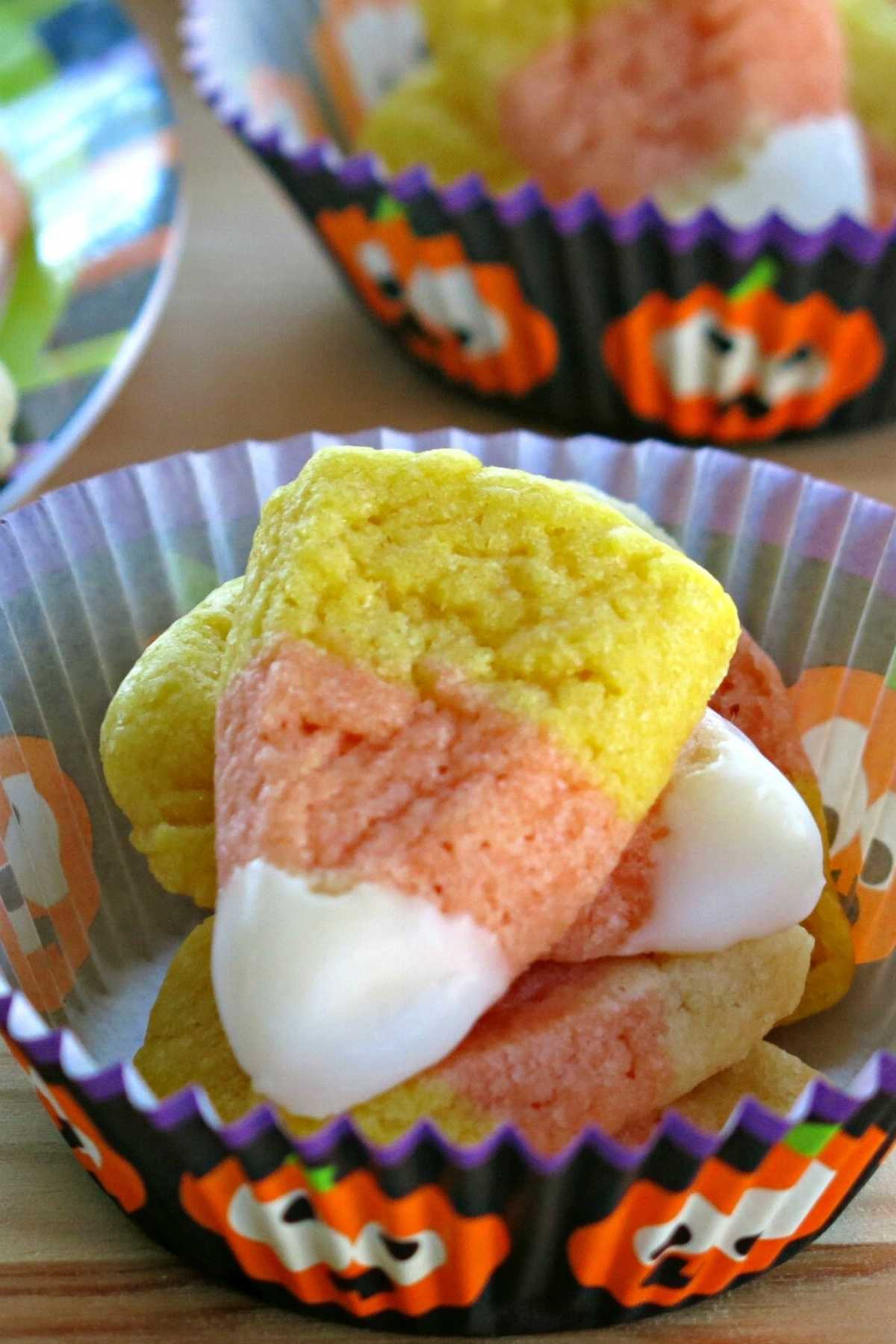 Vegan Candy Corn Cookies in a paper cup.