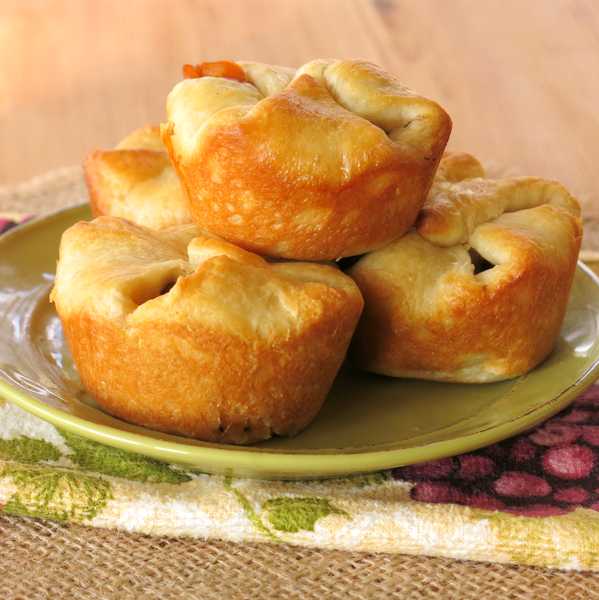 Mini Beef Pot Pies made with Crescent Rolls stacked on plate