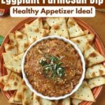 Eggplant Parmesan dip topped with fresh basil and Parmesan cheese and served warm with pita chips.