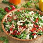 Chicken Arugula Salad with Rice and sesame dressing in a bowl