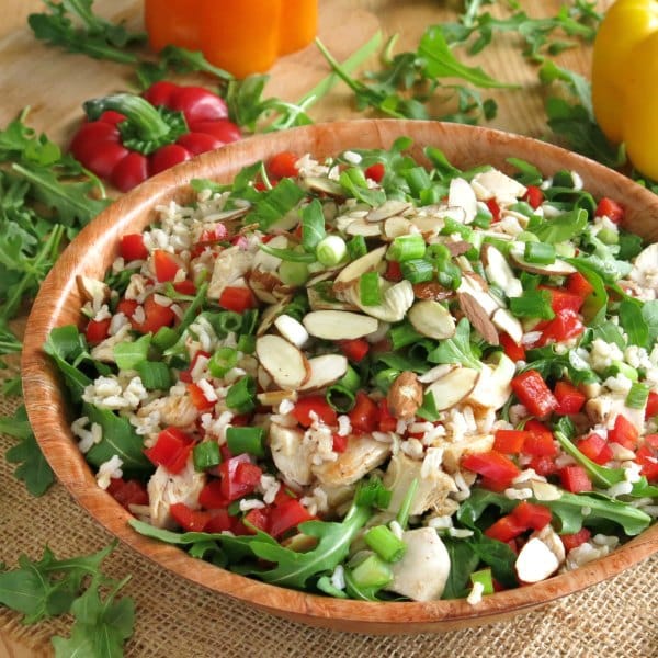 Chicken Arugula Salad with Rice and sesame dressing in a bowl