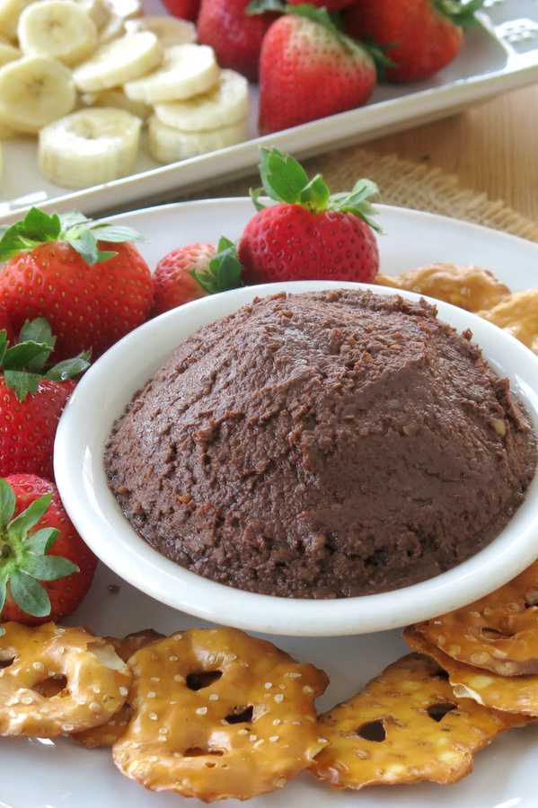 Brownie Batter Dessert Hummus with fruit and pretzel dippers