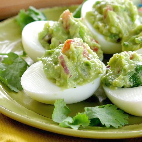 Guacamole Stuffed Deviled Eggs on plate.