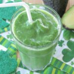 Pineapple green smoothie recipe in glass with straw