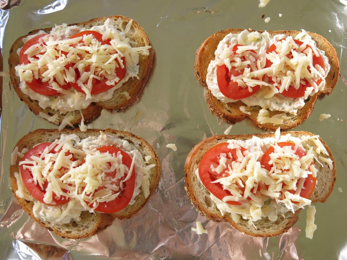 uncooked tuna melt sandwiches on baking sheet