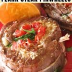 Flank steak pinwheel stuffed with spinach, tomatoes, and mozzarella cheese on a red plate with text overlay.