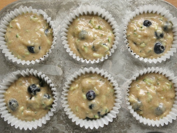 Blueberry Zucchini Muffins batter in muffin tin