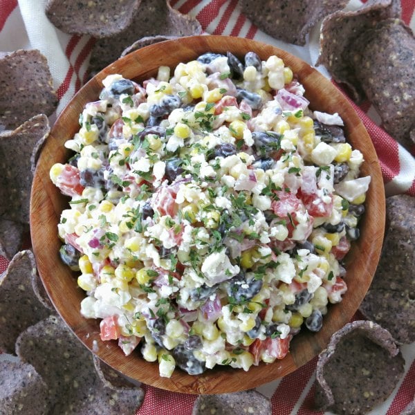 Easy Mexican Street Corn Dip in bowl surrounded by chips