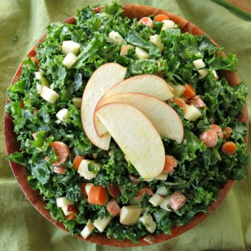 Kale Apple Slaw in bowl with apples fanned on top