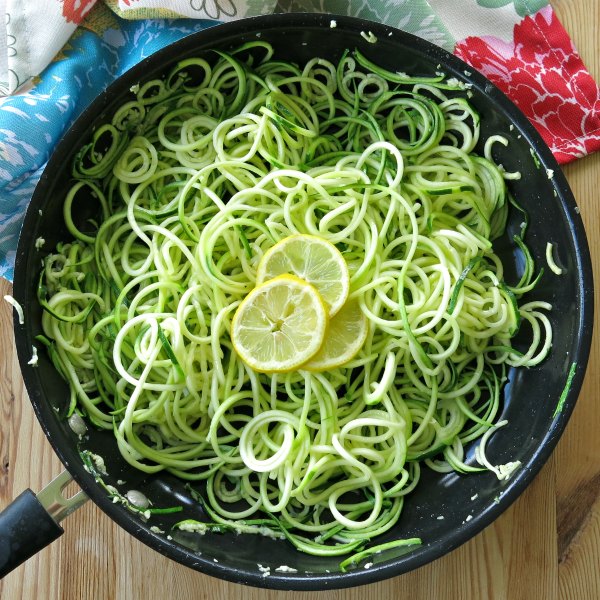 Sauteed Zoodles with lemon and garlic in a skillet 