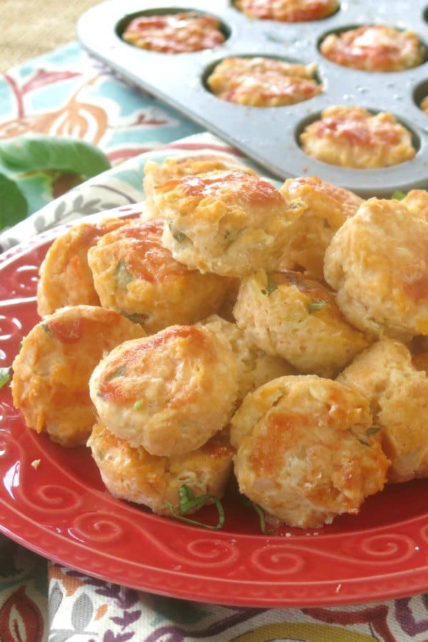 Chicken Meatballs Baked and piled on plate with muffin tin in the background