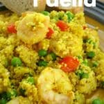 Shrimp Couscous Paella with peppers and peas on a plate.