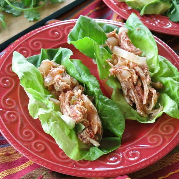 2 Crock-pot Salsa Chicken lettuce wraps on a plate