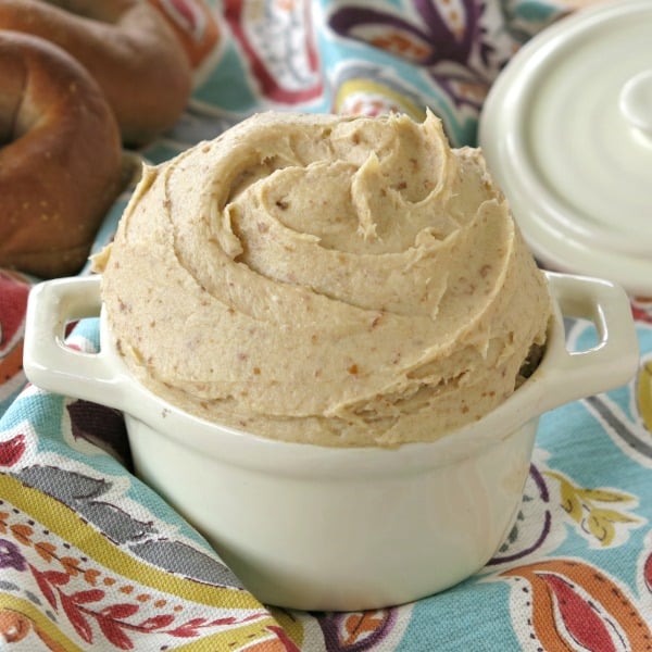 Healthy Cream Cheese Frosting in a crock with lid in the background